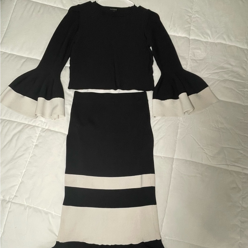 Elegant black and white two piece set with cropped top and pencil line skirt.